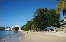  ?? KAVITHA SURANA — THE ASSOCIATED PRESS FILE ?? This January 2015, file photo, shows a beach in Speightsto­wn, Barbados. While some islands in the Caribbean were hard-hit by this season’s hurricanes, others were relatively unscathed and are open for business as usual.