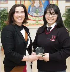  ??  ?? Pictured at the Loreto awards were principal Emma Raughter presenting 6th Year LCVP Student of the Year to Christie Lee.