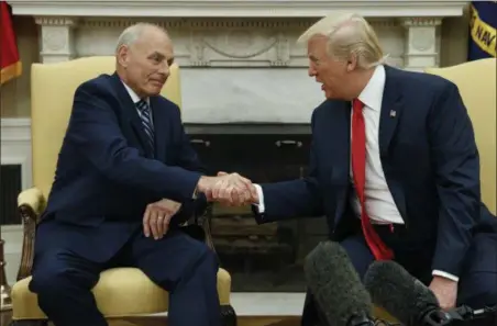  ?? EVAN VUCCI — THE ASSOCIATED PRESS ?? President Donald Trump talks with new White House Chief of Staff John Kelly after he was privately sworn in during a ceremony in the Oval Office with President Donald Trump, Monday in Washington.