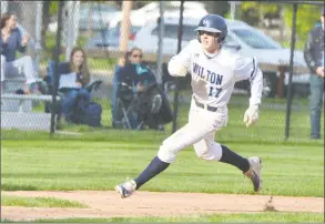  ?? Alex von Kleydorff / Hearst Connecticu­t Media ?? Wilton’s Henry Strmecki rounds third base to score a run during a game against Greenwich on May 8, 2017.