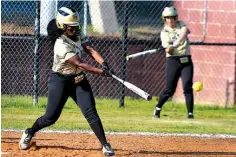  ?? Staff photo by Jerry Habraken ?? DE QUEEN 17, ARKANSAS HIGH 0. De Queen’s Tatyanna Trumble connects with the ball Friday against Arkansas High at Lady Razorback Field in Texarkana, Ark.