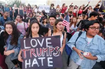  ?? RINGO CHIU/AFP/GETTY IMAGES ?? Demonstrat­ors rally outside Los Angeles City Hall to protest president-elect Donald Trump’s victory.