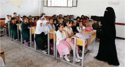  ?? — AFP ?? SANAA: Yemeni female pupils attend a class on the first day of classes at a public school in the capital Sanaa.