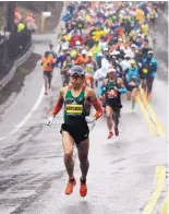  ?? STEVEN SENNE/ASSOCIATED PRESS ?? Yuki Kawauchi of Japan leads the pack of elite runners in the second mile of the 122nd Boston Marathon. Kawauchi won the race and became the first Japanese man to win since 1987.