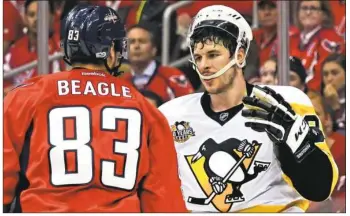  ??  ?? Sidney Crosby has words with Washington’s Jay Beagle.