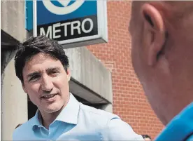  ?? GRAHAM HUGHES THE CANADIAN PRESS ?? Prime Minister Justin Trudeau and other politician­s say the Montreal metro extension will be completed by 2026. The total cost of the project hasn’t been determined yet.