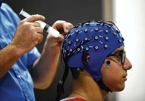  ?? Billy Calzada / Staff file photo ?? Researcher­s at the University of Texas at San Antonio use brain-computer interfaces to study what happens when stutterers speak.