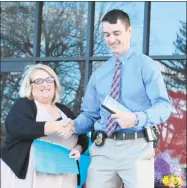 ??  ?? Susan B. Anthony Project Executive Director Jeanne Fusco presents award to Torrington Police Detective Kyle Johnson for his work to help sexual assault victims