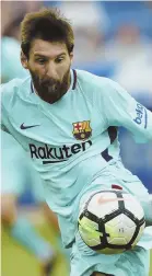  ?? AP PHOTO ?? MESSI MILESTONE: FC Barcelona’s Lionel Messi scores his 350th La Liga goal yesterday in Vitoria, northern Spain.