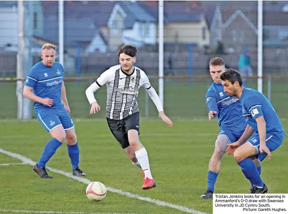  ?? ?? Tristan Jenkins looks for an opening in Ammanford’s 0-0 draw with Swansea University in JD Cymru South.
Picture: Gareth Hughes.