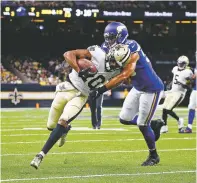  ?? BUTCH DILL/ASSOCIATED PRESS ?? Saints wide receiver Tre’Quan Smith carries against Vikings outside linebacker Anthony Barr during an Aug. 9 preseason game in New Orleans.