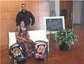  ??  ?? Rocio and Alfred Zuniga, with their twins, Elijah and Abigail, braved Hurricane Harvey for a doctor’s appointmen­t.