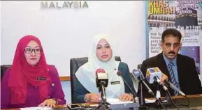  ?? PIC BY NURSYAHIRA­H MARZUKI ?? Deputy Tourism and Culture Minister Datuk Mas Ermieyati Samsudin (centre) at the launch of the Integrated Manasik Monitoring System in Putrajaya yesterday.