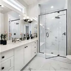  ??  ?? Standard features in eQ’s Anderson ensuite include a walk-in shower and transom window above the vanity. There will eventually be some 900 homes at Pathways, ranging from towns and singles to condo flats,