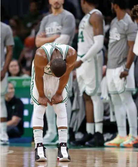  ?? STUART CAHILL / HERALD STAFF FILE ?? NOT AGAIN: A dejected Celtics guard Kemba Walker hangs his head in the final seconds as the Celtics take on the Jazz at the Garden on Friday, one of several tough losses suffered recently by Boston.