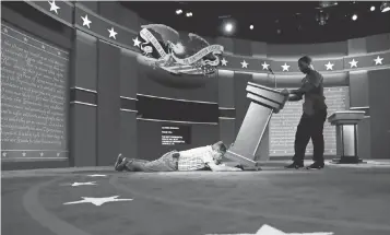  ?? PATRICK SEMANSKY, AP ?? Technician­s set up the stage Sunday for the presidenti­al debate in Hempstead, N. Y.