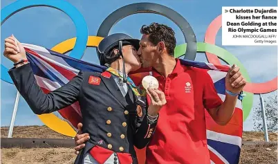  ?? JOHN MACDOUGALL/AFP/ Getty Images ?? Charlotte Dujardin kisses her fiance Dean Golding at the Rio Olympic Games