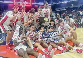  ?? Pete Paguaga/Hearst Connecticu­t Media ?? Cromwell players celebrate after winning the CIAC Division IV championsh­ip at Mohegan Sun Arena on Sunday.