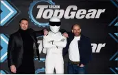  ?? STUART C. WILSON — GETTY IMAGES ?? From left, Paddy McGuinness, The Stig and Chris Harris attend the “Top Gear” world TV premiere at Odeon Luxe Leicester Square on Jan. 20, 2020, in London.