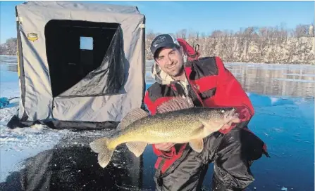  ?? PHOTO COURTESY JAMIE WEIR ?? Ben Gottfried with his walleye caught last week in Hamilton Harbour. The fish was 28 inches long, and about eight pounds.