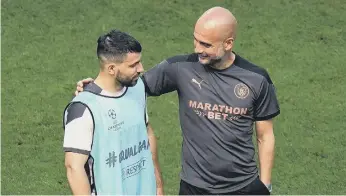  ??  ?? Manchester City’s Sergio Aguero and Pep Guardiola look relaxed ahead of the UEFA Champions League final.