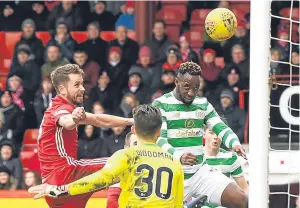  ?? Picture: SNS. ?? Moussa Dembele heads home Celtic’s opening goal.