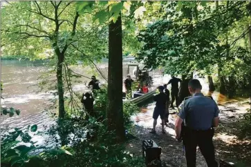  ?? Burlington Volunteer Fire Department ?? Cews search the Farmington River in Avon for two missing swimmers on July 16, 2021. The bodies of the two boys were recovered three days later.