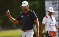  ?? Tom Pennington / Getty Images ?? Sam Burns reacts after putting in to win the Charles Schwab Challenge during the first playoff hole on the 18th green during Sunday’s final round at Colonial Country Club in Fort Worth, Texas.