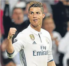  ??  ?? Hat-trick hero Cristiano Ronaldo celebrates scoring his second goal for Real Madrid against Atletico.