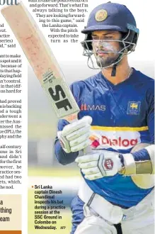  ?? AFP ?? Sri Lanka captain Dinesh Chandimal inspects his bat during a practice session at the SSC Ground in Colombo on Wednesday.