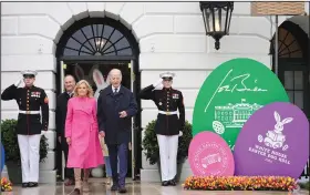  ?? (File Photo/AP/Evan Vucci) ?? President Joe Biden (center right) and first lady Jill Biden arrive Monday at the White House Easter Egg Roll on the South Lawn of the White House in Washington. Stories circulatin­g online incorrectl­y claim Biden banned religious symbols from a White House Easter egg art contest.