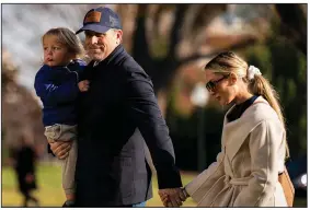  ?? (The Washington Post/Al Drago) ?? Hunter Biden walks on the South Lawn of the White House with son Beau Biden Jr. and wife Melissa Cohen in December.