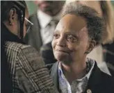  ?? PAT NABONG/SUN-TIMES PHOTOS ?? Mayor Lori Lightfoot meets attendees of a Leaders Network meeting at the Columbus Park Refectory in Austin on Tuesday.