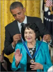  ?? CAROLYN KASTER — THE ASSOCIATED PRESS FILE ?? In this file photo, President Barack Obama awards American labor leader and civil rights activist Dolores Clara Fernandez Huerta the Presidenti­al Medal of Freedom, during a ceremony in the East Room of the White House in Washington.