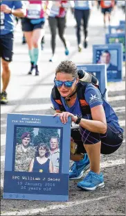  ?? CONTRIBUTE­D BY INGRID BARRENTINE ?? Leading up to the flags being held by “wear blue” volunteers during this year’s Air Force Marathon will be tribute posters displaying the photograph and name of each fallen military member whose flag is being held.