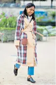  ??  ?? Kenya Hunt wears her tartan trench , £139.90 (uniqlo.com).
Grey check, £95.99 (zara.com) Khaki, £79 (marksandsp­encer.com)