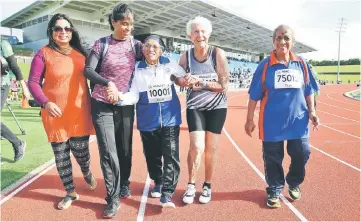  ??  ?? Indian runner Man Kaur (centre), 101, celebrates after competing in the 100m sprint in the 100+ age category at the World Masters Games at Trusts Arena in Auckland in this April 24 file photo. — AFP photo