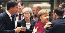  ?? PHOTO: GETTY IMAGES ?? Good to see you . . . Britain’s Prime Minister Theresa May (centre) looks on as (left to right) Netherland­s’ Prime Minister Mark Rutte, Belgian Prime Minister Charles Michel, German Chancellor Angela Merkel and France’s President Emmanuel Macron greet each other at the European Council in Brussels, yesterday.