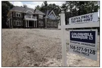  ?? (AP) ?? A sign stands in front of a new home in Westwood, Mass., in this photo from September. Constructi­on of new homes fell again in February 2020, but not as much as the previous month.