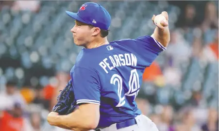  ?? CARMEN MANDATO/GETTY IMAGES ?? Toronto's Nate Pearson delivers a pitch during the first inning of Sunday's game against the Astros in Houston. The highly touted Pearson had a rough outing, lasting only 21/3 innings, walking four with no strikeouts.