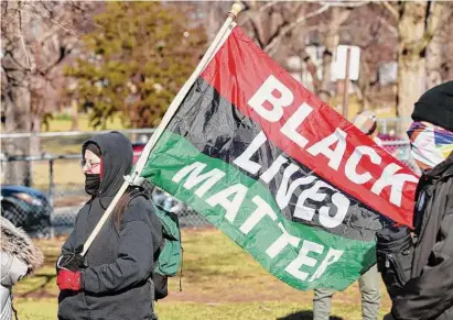  ?? Patrick Sikes/Hearst CT Media Group ?? Protesters rally in Hartford on Saturday, the day after authoritie­s in Memphis, Tenn. Released video showing the police beating of Tyre Nichols following a traffic stop on Jan. 7. Nichols, a Fed-Ex worker and father to a 4-year-old son, died days later in the hospital. The five Memphis Police Department officers involved in the assault, including Bloomfield High School grad Desmond Mills Jr., have been fired and charged with murder.