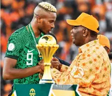  ?? — AFP file photo ?? Nigeria’s forward Victor Osimhen (left) speaks with President of Ivory Coast Alassane Ouattara at the end of the Africa Cup of Nations (CAN) final football match between Ivory Coast and Nigeria at Alassane Ouattara Olympic Stadium in Ebimpe, Abidjan.