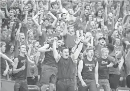  ?? BILLY HARDIMAN/FOR THE REPUBLIC ?? American Leadership Academy Patriots fans cheer during a game against the Higley Knights in the 5A Boys Volleyball State Championsh­ips at Mesquite High School on May 11 in Gilbert.