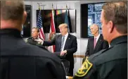  ?? ANDREW HARNIK / AP ?? President Donald Trump (center) has expressed support for several gun measures after the school shooting in Parkland, Florida, killed 17 on Feb. 14.