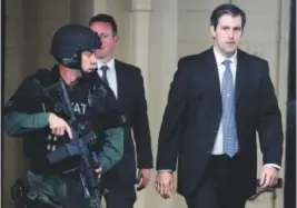  ??  ?? Michael Slager, right, leaves the Charleston County Courthouse under the protection of the sheriff ’s department after a mistrial was declared for his trial last week in South Carolina. Mic Smith, The Associated Press