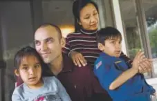  ?? Dai Sugano, Bay Area News Group ?? Tomasz Kruczek, his wife, Ailyn Ubaldo-kruczek and their children, Gabriel, 8, right, and Isabella, 6, moved to their Fremont, Calif., home from Scotland.