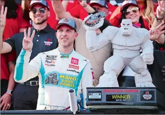  ?? DERIK HAMILTON/AP PHOTO ?? Denny Hamlin, front left, celebrates in Victory Lane after winning the NASCAR Cup race at Dover Motor Speedway on Sunday in Dover, Del.