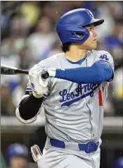  ?? GREGORY BULL/ASSOCIATED PRESS ?? The Dodgers’ Shohei Ohtani watches his groundout during the seventh inning against the Padres on Saturday in San Diego. Ohtani left after his fourth at-bat in a 5-0 win. He went 0 for 3.