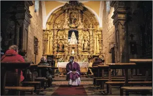  ?? ?? Salvadoran priest Edgardo Rivera, 42, talks to his parishione­rs Nov. 27 at the Catholic church of Cazurra, a village of around 75 inhabitant­s, in Zamora province.