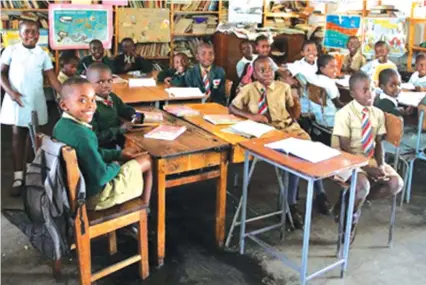  ??  ?? Primary school children in class